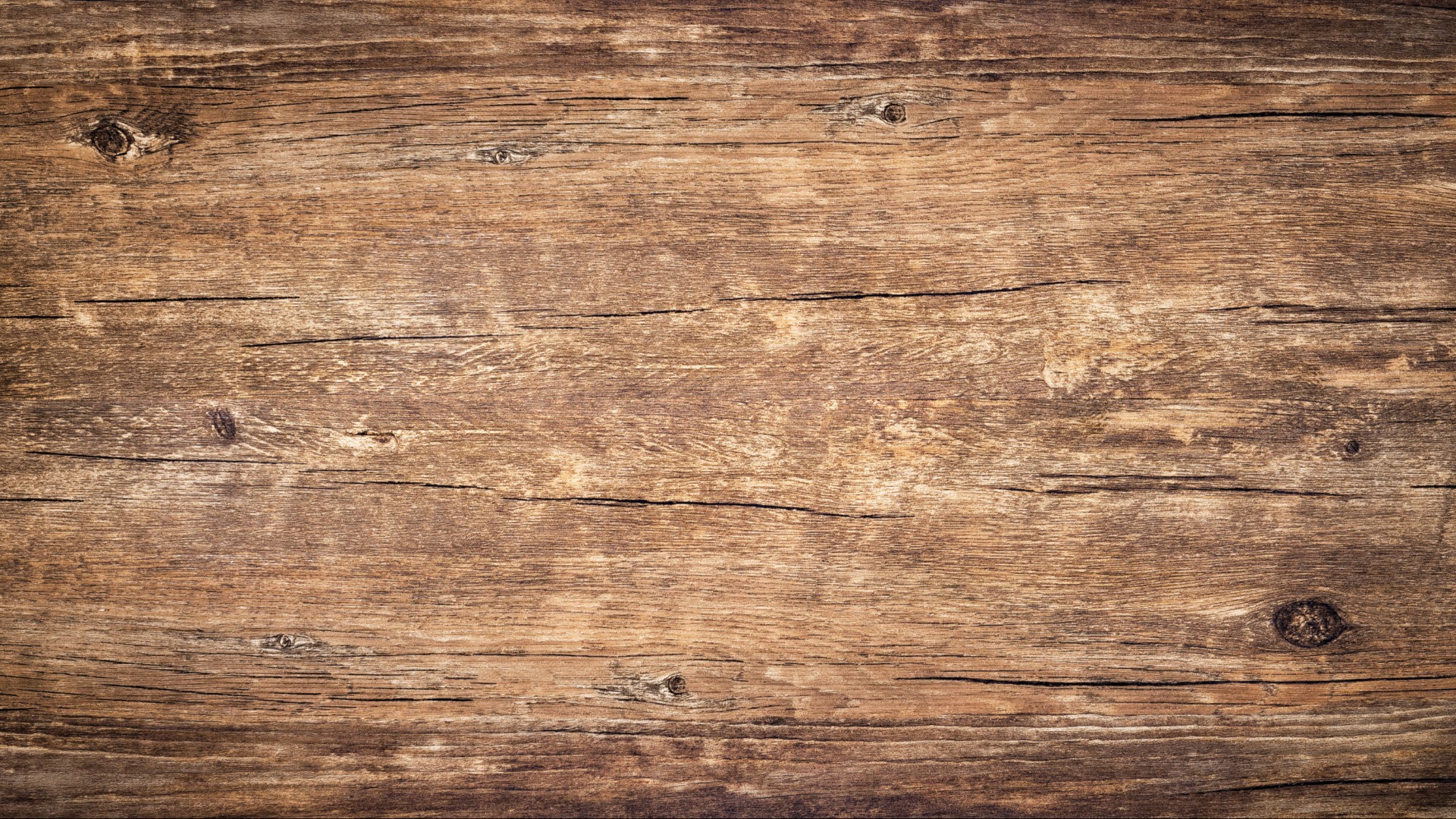 Draufsicht auf einen verwitterten Vintage-Holztisch mit Rissen